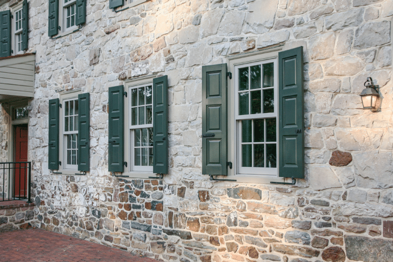 vixen hill green shutters on stone wall